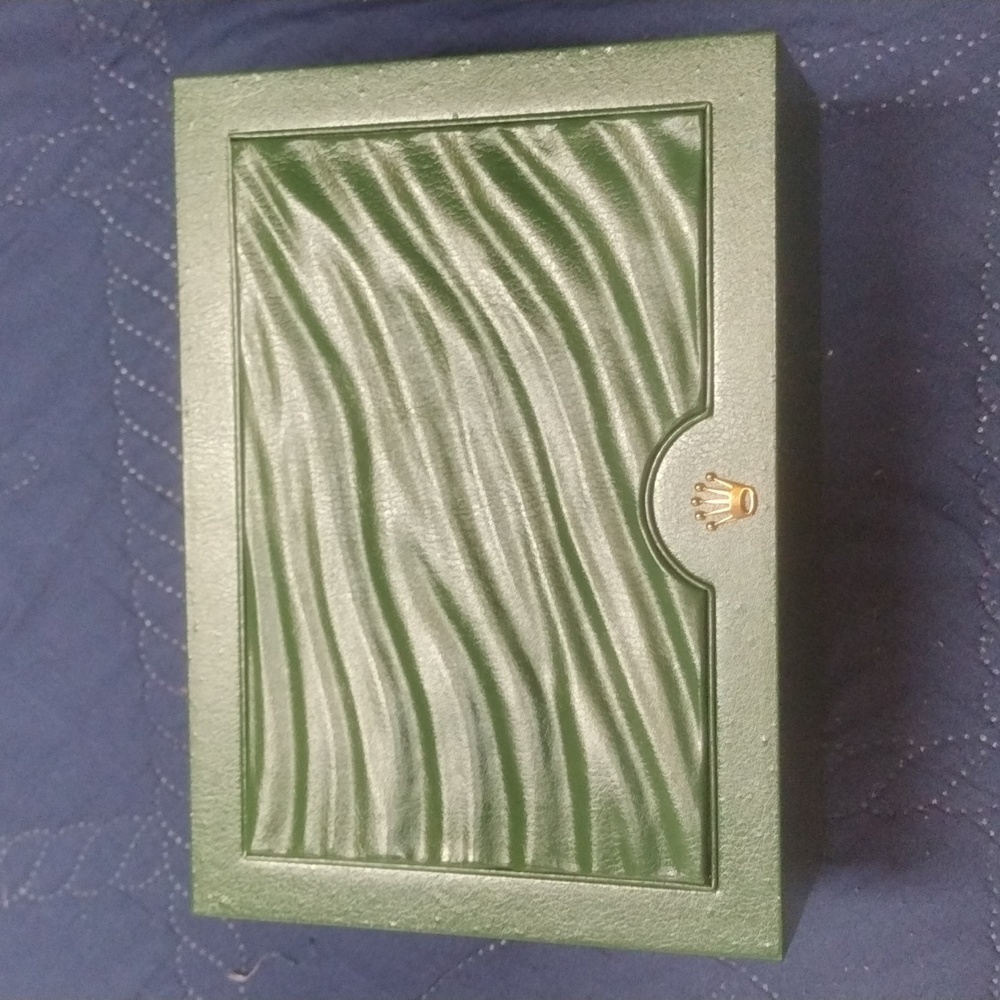 Authentic Rolex green leather box.